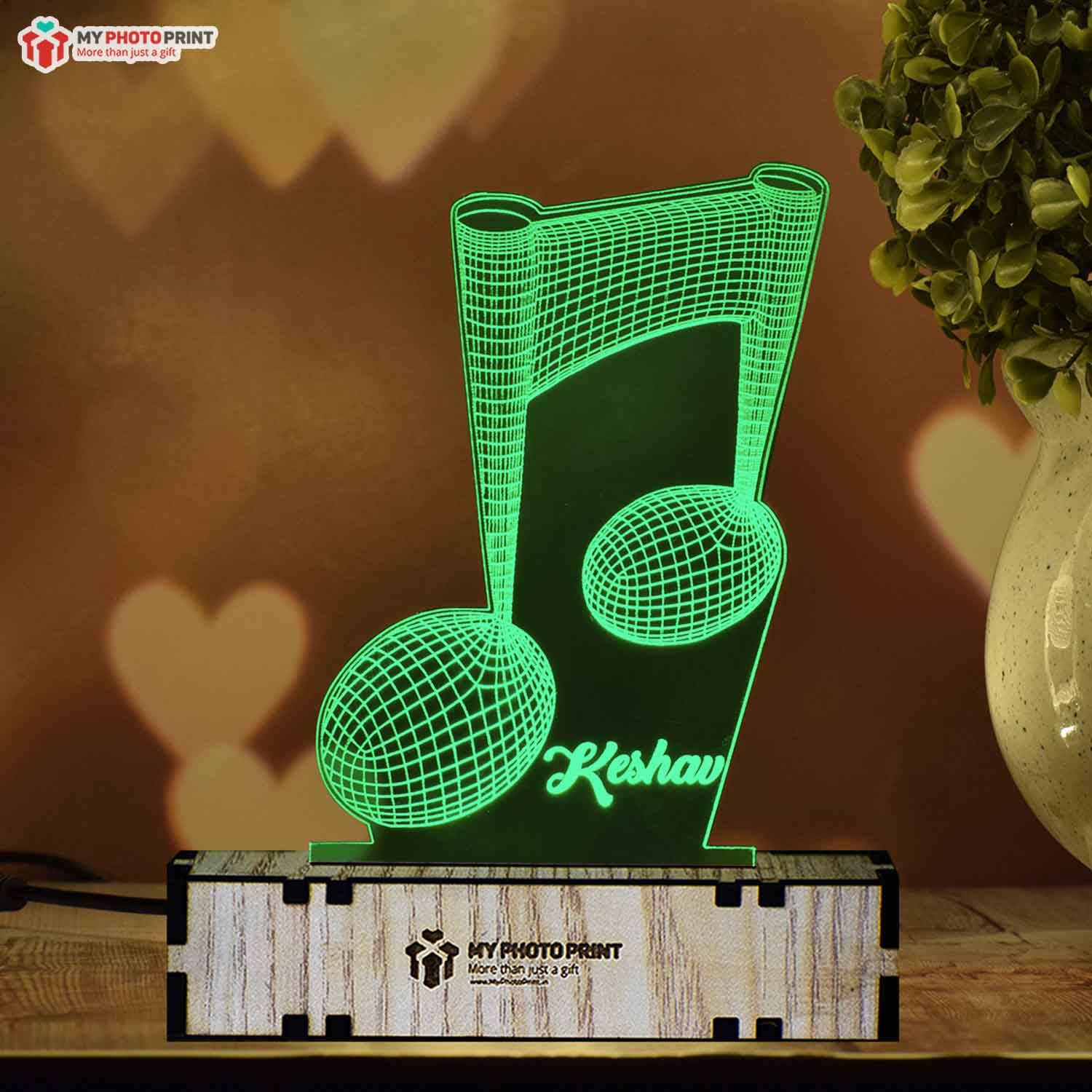 Music Note Shape Night Lamp India - Get One Today Music Note Shape is a unique gift item for men. This name night lamp for him gives the impression of the shape of the Music Note in a metal casing. There are six shapes in this product. Name, engraving design, and size details are in the base and there is a black cord with white base. Overall, it looks great.