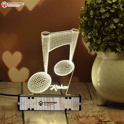 Music Note Shape Night Lamp India - Get One Today Music Note Shape is a unique gift item for men. This name night lamp for him gives the impression of the shape of the Music Note in a metal casing. There are six shapes in this product. Name, engraving design, and size details are in the base and there is a black cord with white base. Overall, it looks great.