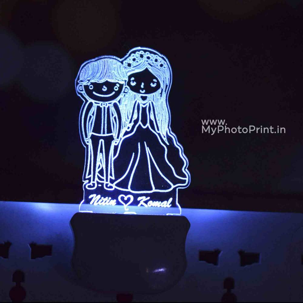 https://storage.myphotoprint.in/products/939200_personalized-cartoonist-couple-plug-acrylic-night-lamp-with-multicolor-lights-1600141803.jpg